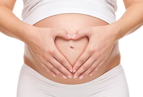 Pregnant woman loving her baby