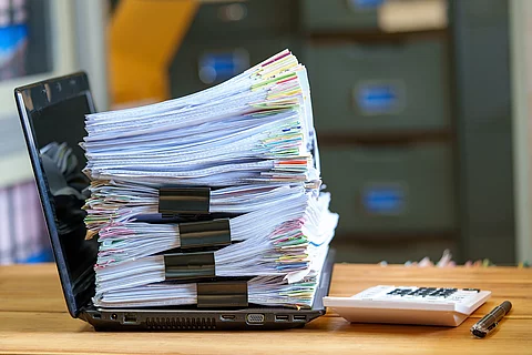 File in database stack of document pace on laptop on the desktop