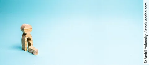 A wooden man with a void in the body from which the child fell. 