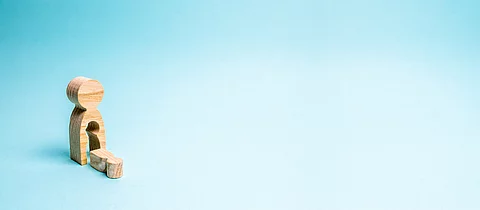 A wooden man with a void in the body from which the child fell. 