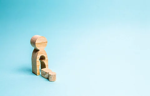 A wooden man with a void in the body from which the child fell. 