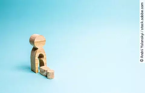 A wooden man with a void in the body from which the child fell. 