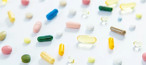 Supplements and vitamins on a white background. Selective focus.