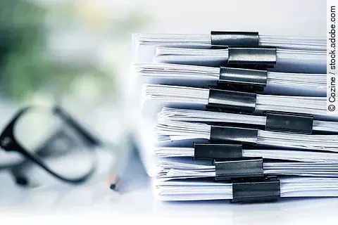 extreamly close up the stacking of office working document with 